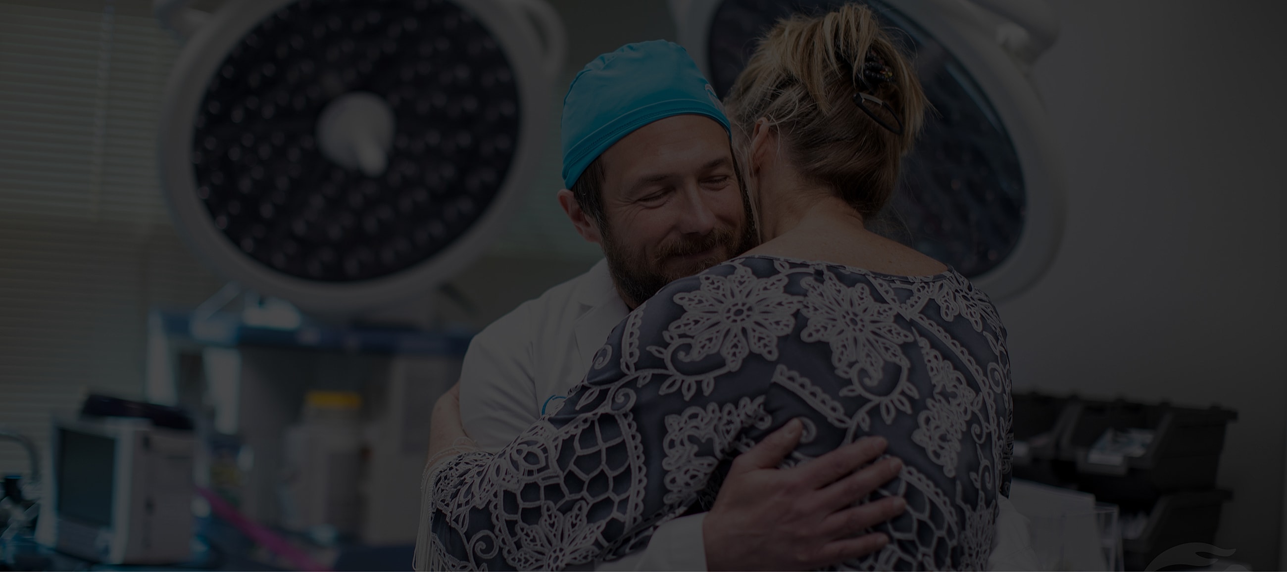 Doctor comforting patient in medical environment.