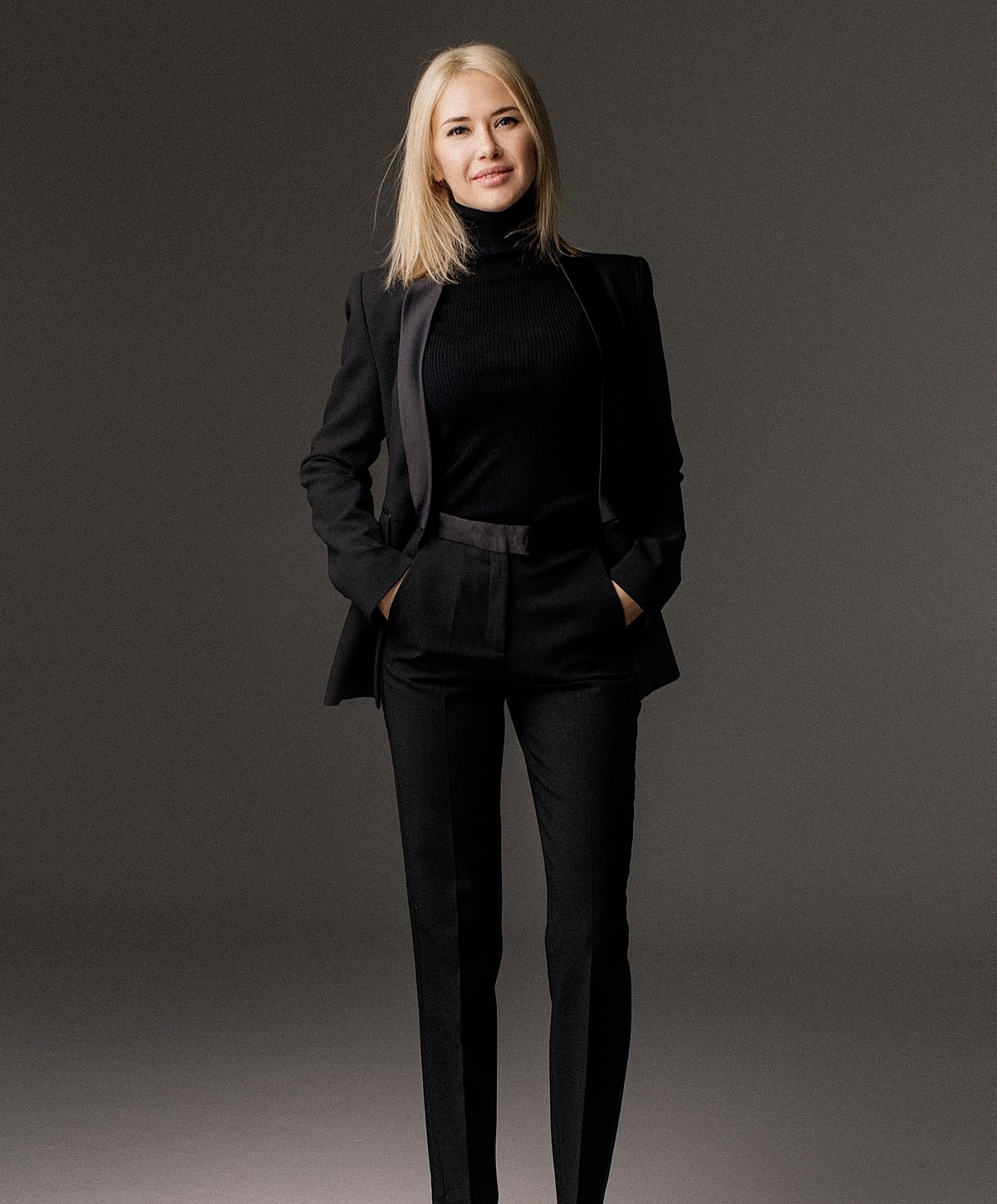 Woman in stylish black suit portrait