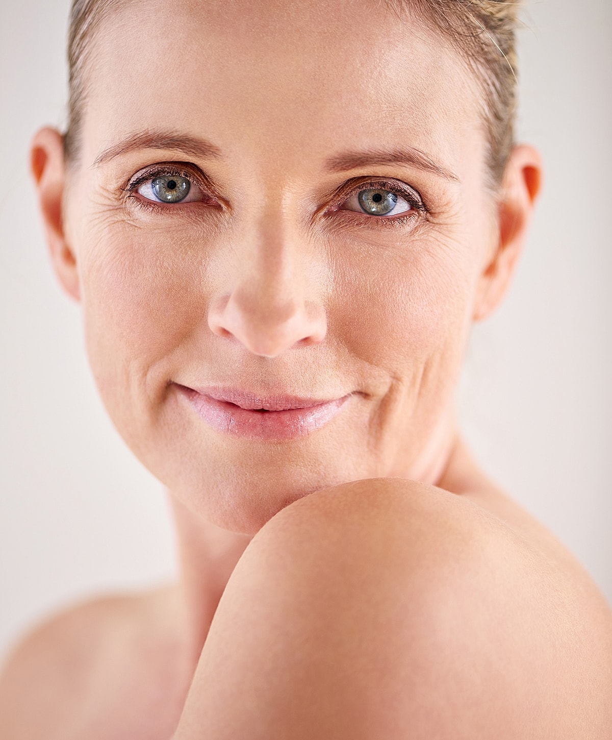 Close-up of a smiling, confident woman.